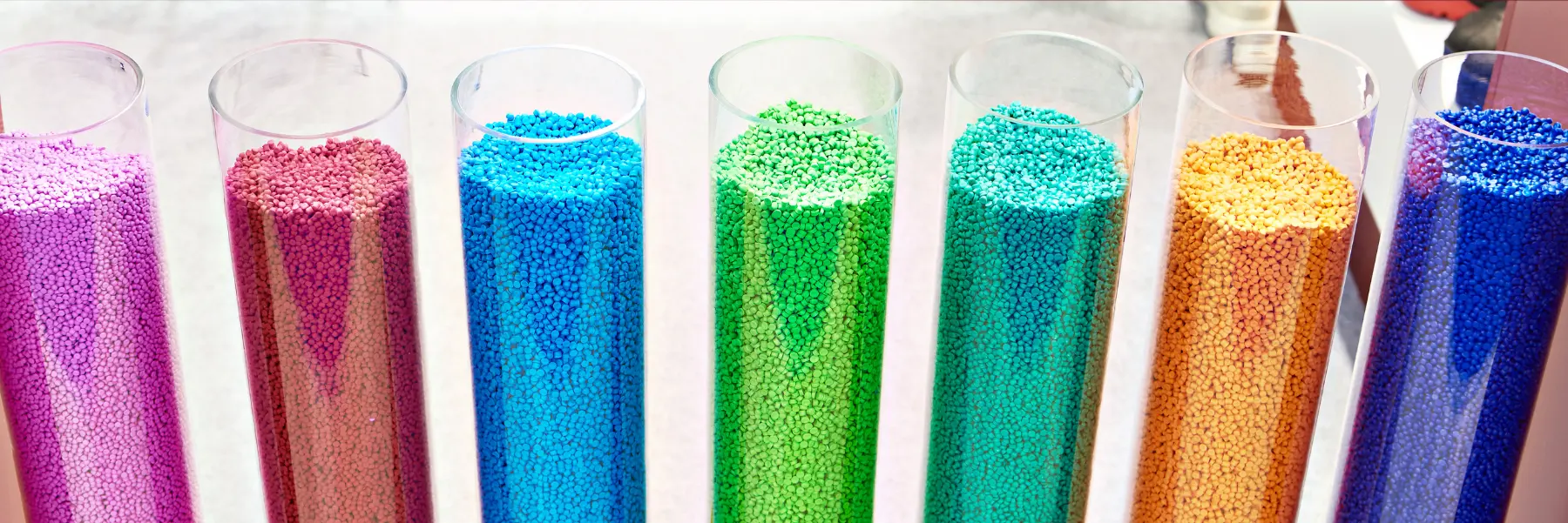 Bulk plastic granules in storage storage tubes.